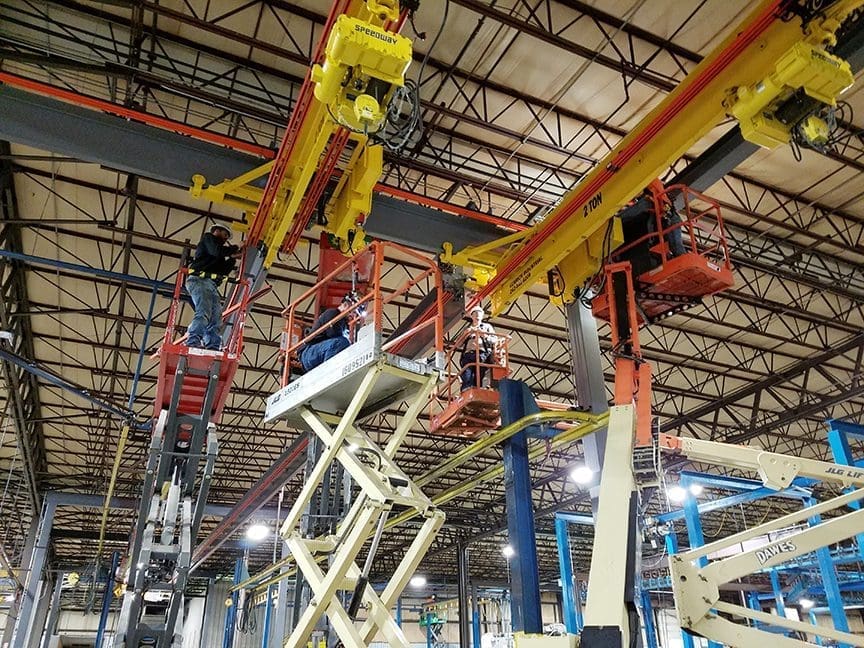 Crew of men working on Ceiling Supported Monorail by CraneWerks of Morristown, IN