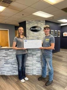 Ashley Larochelle, President of CraneWerks and Gavin Shaw, recipient of the 2023 Roger Graham Scholarship fund.