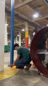 Conner Davis of CraneWerks working on a column, supporting a CraneWerks installation job