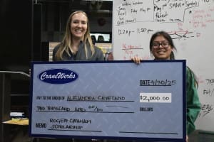 Ashley Larochelle, President of CraneWerks, awards the 2025 Roger Graham Scholarship to Alejandra Cayetano